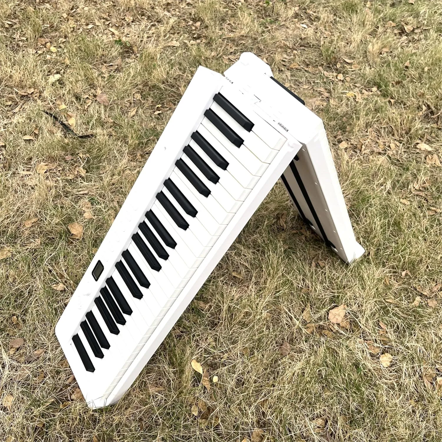 New 88 Key Foldable Electronic Piano can be folded in 180°,more portable. True and Pure Grand Piano Sound Source by France DREAM, Foot Pedal/Power adapter/Delicate Handbag (White )